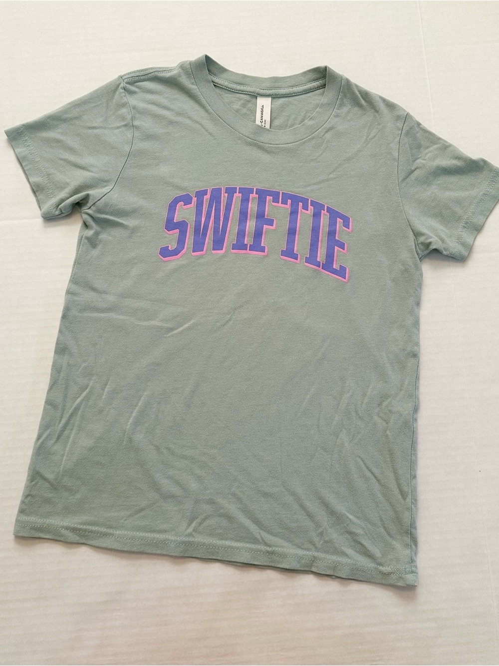 Bella+Canvas Sage Green SWIFTIE Tee with Purple-Pink Graphic